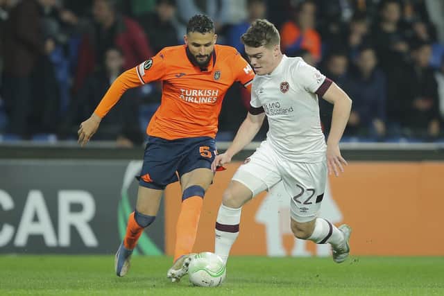 Euan Henderson, making his first start in a year and a half, vies for the ball with Basaksehir's Ahmed Touba . Picture: AP