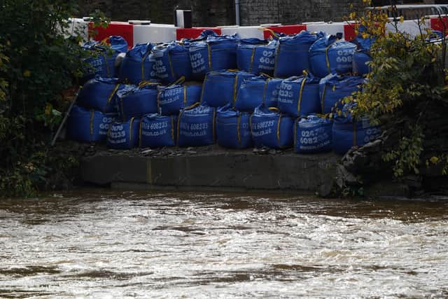 Flood defences are deployed along the River Teviot after a major flood incident was declared in Hawick (Picture: Ian Forsyth/Getty Images)