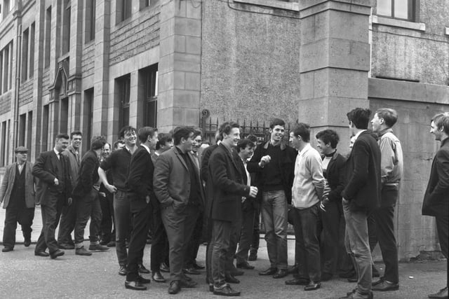 Apprentices waiting to start their day of work outside Bertram & Son Ltd on Leith Walk in June 1966.