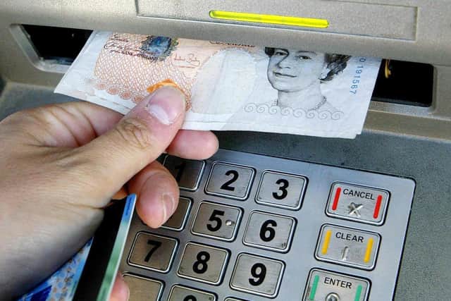 The world is moving towards an economy in which cash is a thing of the past, replaced by cards, smartphones and even a chip implanted in your hands (Picture: Gareth Fuller/PA)
