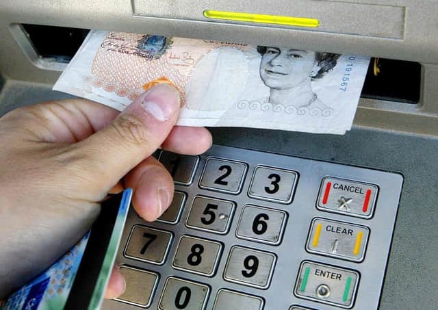 The world is moving towards an economy in which cash is a thing of the past, replaced by cards, smartphones and even a chip implanted in your hands (Picture: Gareth Fuller/PA)