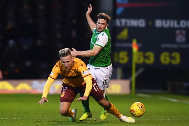 Scott in action for Motherwell against Hibs shortly before his Hull switch