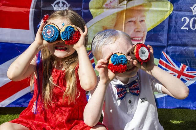 Emily Bell, aged 6, and best pal Noah Weir, age 5, enjoy a garden party in Armadale. Photo: Lisa Ferguson.