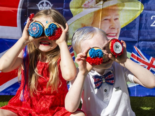 Emily Bell, aged 6, and best pal Noah Weir, age 5, enjoy a garden party in Armadale. Photo: Lisa Ferguson.