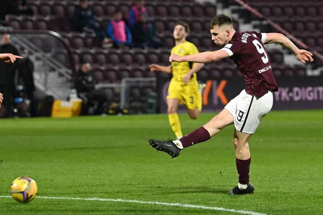 Ben Woodburn fires Hearts into a 2-0 advantage with the aid of a deflection. Picture: SNS
