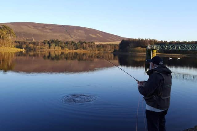 An angler fishing on a summer night at Harlaw. Picture: Nigel Duncan