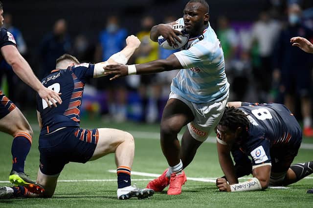 Edinburgh's centre George Taylor (L) fights for the ball with Racing92's French flanker Jordan Joseph (C) during the match at the U Arena in Nanterre, near Paris on April 4, 2021. (Photo by FRANCK FIFE/AFP via Getty Images)