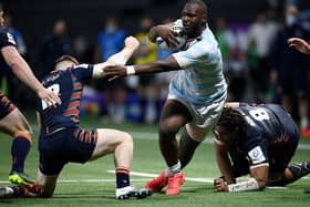 Edinburgh's  centre George Taylor (L) fights for the ball with Racing92's French flanker Jordan Joseph (C) during the match  at the U Arena in Nanterre, near Paris on April 4, 2021. (Photo by FRANCK FIFE/AFP via Getty Images)