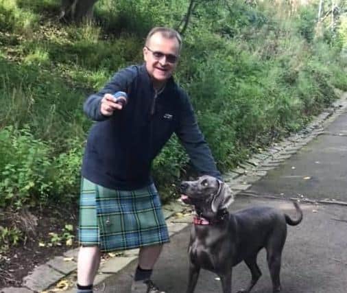 CEO of the charity John MacMillian with his dog Blu are fundraising for the centre.