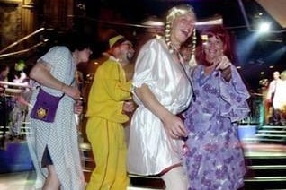 Stag-party revellers dance at the Revolution on Lothian Road, June 29, 2001. Is that Ali G dancing with Agnetha and Frida from ABBA? Revolution is no longer a nightclub and has since been transformed into Wetherspoon gastro pub Caley Picture House.