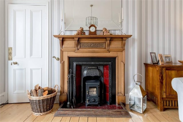 Period fireplace in sitting room.