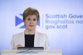 Nicola Sturgeon at the podium in 2020 for a Covid briefing (Picture: Jane Barlow/WPA Pool/Getty Images)