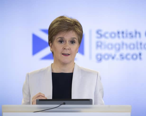 Nicola Sturgeon at the podium in 2020 for a Covid briefing (Picture: Jane Barlow/WPA Pool/Getty Images)