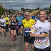 Thirsty runners at next month's Edinburgh Marathon will be able to get a drink at 10am after the beer tent won permission to open early.