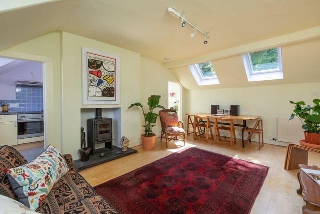 The cottage has a large living and dining room space with sea views and south-facing Velux windows.