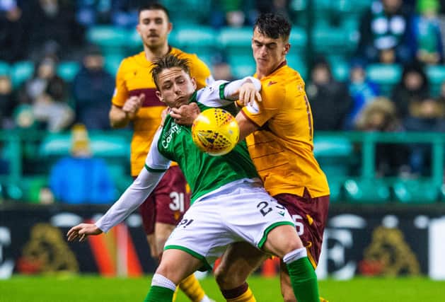 Scott Allan and Barry Maguire battle for possession in a meeting between the two teams at Easter Road last season