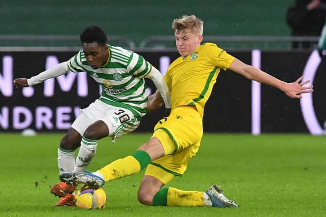 Hibs left-back Josh Doig vies for the ball with Celtic's Jeremie Frimpong during the clash in January