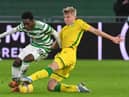 Hibs left-back Josh Doig vies for the ball with Celtic's Jeremie Frimpong during the clash in January