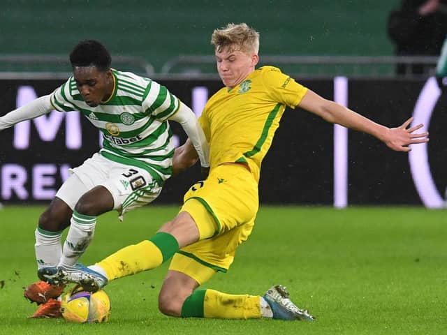 Hibs left-back Josh Doig vies for the ball with Celtic's Jeremie Frimpong during the clash in January