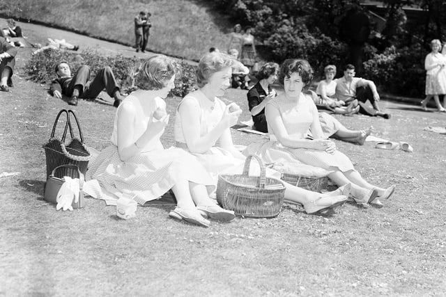 Three girls lunching in Princes Street Gardens during a heatwave in Edinburgh in June 1960.