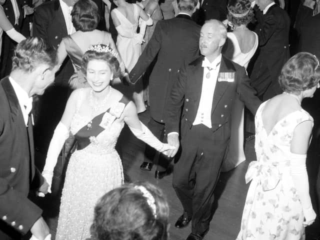 Queen Elizabeth II dances an eightsome reel at the Royal Company of Archers' Ball in the Assembly Rooms, Edinburgh, in 1966.