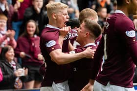 Alex Cochrane celebrates with Cammy Devlin after scoring to put Hearts 1-0 up at Tynecastle park. Picture: SNS
