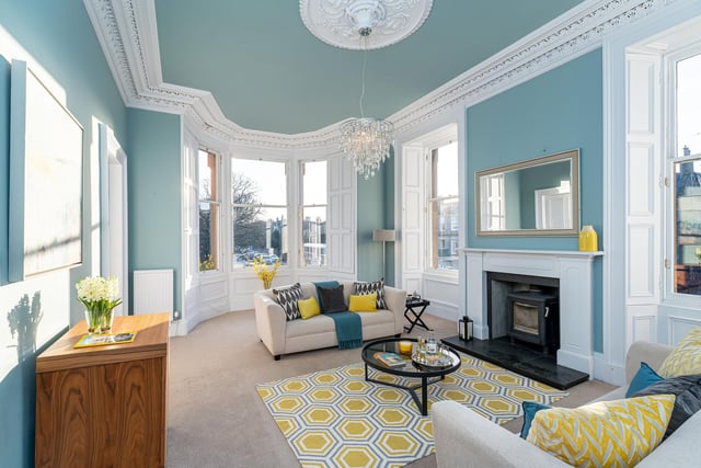 A light, bay-windowed drawing room overlooking Abercorn Park with an abundance of period features including exquisite ornate cornicing, ceiling rose, working shutters and a focal fireplace with a wood burning stove.