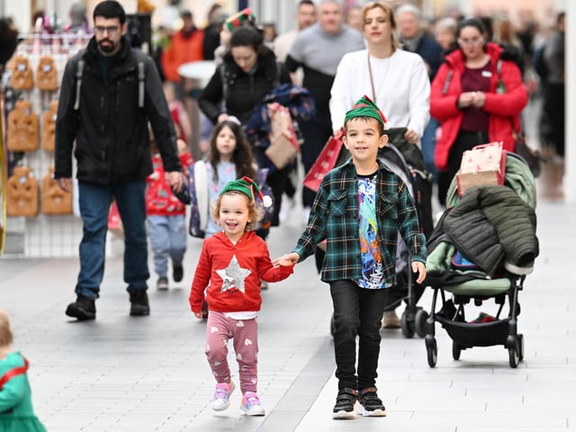 The elf toddle walkers were also given extra encouragement and entertained half-way round by 50 singers from the Singergie Choir.
