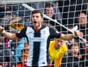 St Mirren's Mihai Popescu celebrates scoring for St Mirren during the play-off penalty shootout win over Robbie Neilson's Dundee United. Photo: Rob Casey/SNS Group