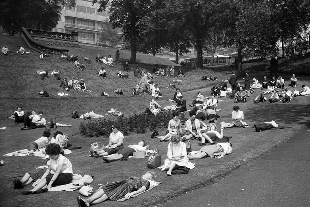 Sunbathers in Princes Street Gardens during a heatwave in 1963.