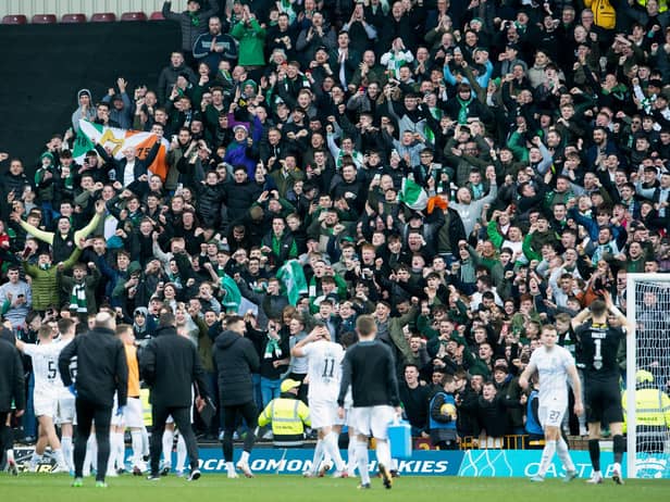 Hibs players celebrate in front of the away fans at full-time after successfully making it into the semi-finals of the Scottish Cup. Picture: SNS