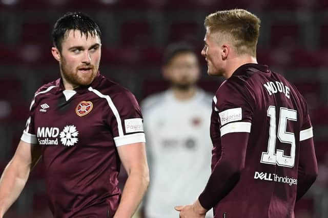John Souttar and Taylor Moore exchange words during Hearts' victory over Ross County. Picture: SNS