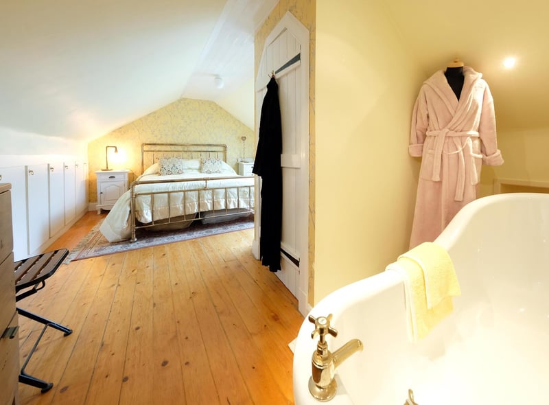 The generous main double bedroom comes with a free standing roll top bath and excellent storage facilities.
