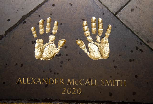 Mr McCall Smith was also reunited with a set of his hand-prints preserved in stone in the City Chambers quadrangle.