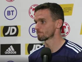 Paul McGinn speaks to the Scotland media team after making his international debut