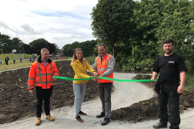 The new cycle track at Figgate Park was opened on Tuesday afternoon with a ceremonial ribbon cutting. From left to right: Craigentinny Depot Manager; Adrian Mathieson, Friend of Figgate Park member; Rachel Murray, Hitachi Rail Production Manager; Paul Charles and Hitachi Rail employee; Jamie Daly.