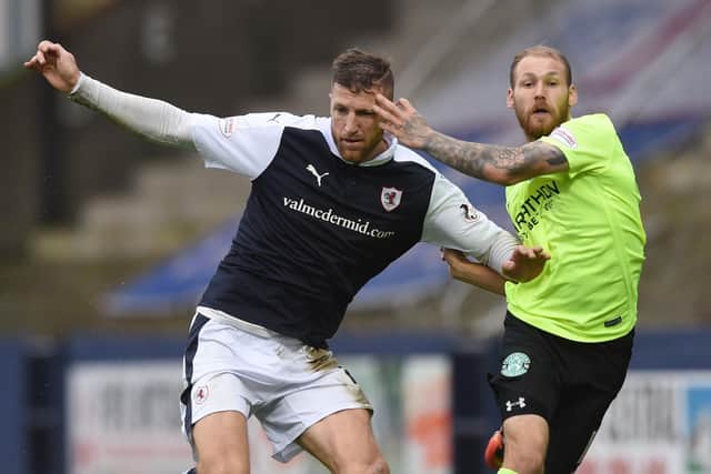Iain Davidson in action against Hibs star Martin Boyle in October 2016. Picture: SNS