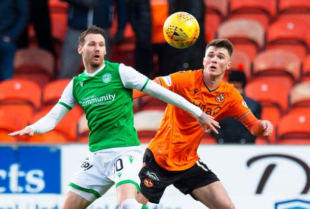 Martin Boyle tussles with Dundee United's Jamie Robson during Hibs' last visit to Tannadice