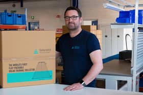Service and installation manager Kris Aitchison with a packaged SolarisKit collector. Picture: contributed.