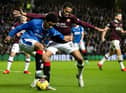 Toby Sibbick battles for possession with Malik Tillman during Hearts' 1-0 defeat to Rangers in November. Picture: SNS