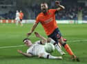 Euan Henderson slides in on Basaksehir's Brazilian defender Leo Duarte to show him that he's quite prepares to close down with aggression. Picture: AP