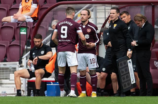 Barrie McKay replaces Ben Woodburn to make his Hearts debut against Hibs.