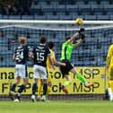 Matt Macey saves from Zak Rudden during Hibs' 3-1 defeat by Dundee
