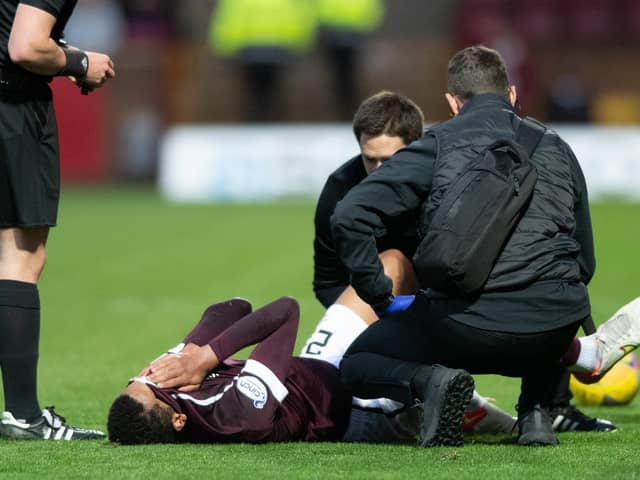 Toby Sibbick screams in pain before at Fir Park before being carried off