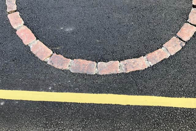The cross has been covered in tarmac  Picture: Nikki Laird