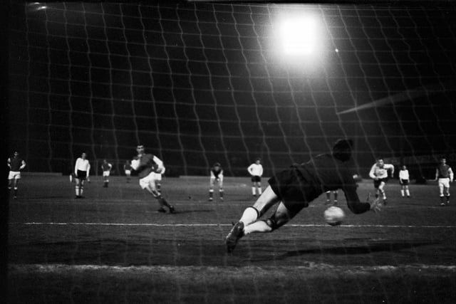 Joe Davis scores Hibs' second goal against Clyde under the floodlights at Easter Road in March 1966.