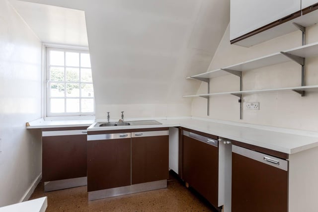 While the kitchen could do with being modernised, there is plenty of space for storage and getting about while cooking.