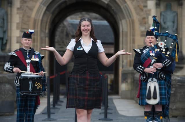 Guide Mhairi Summers and Pipe Major Stevie Small and Drum Major Mick Hay open the iconic doors to Edinburgh Castle as the famous fortress welcomes visitors for the first time since closing in March.