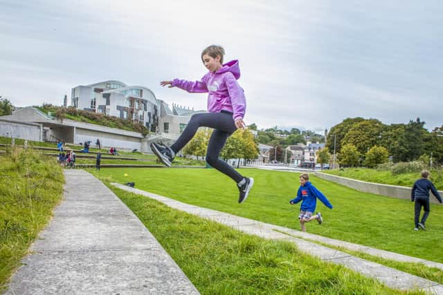 Connie Rutherford, 12 and Edward Renwick 10 do Parkour in Holyrood Park.