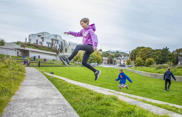 Connie Rutherford, 12 and Edward Renwick 10 do Parkour in Holyrood Park.